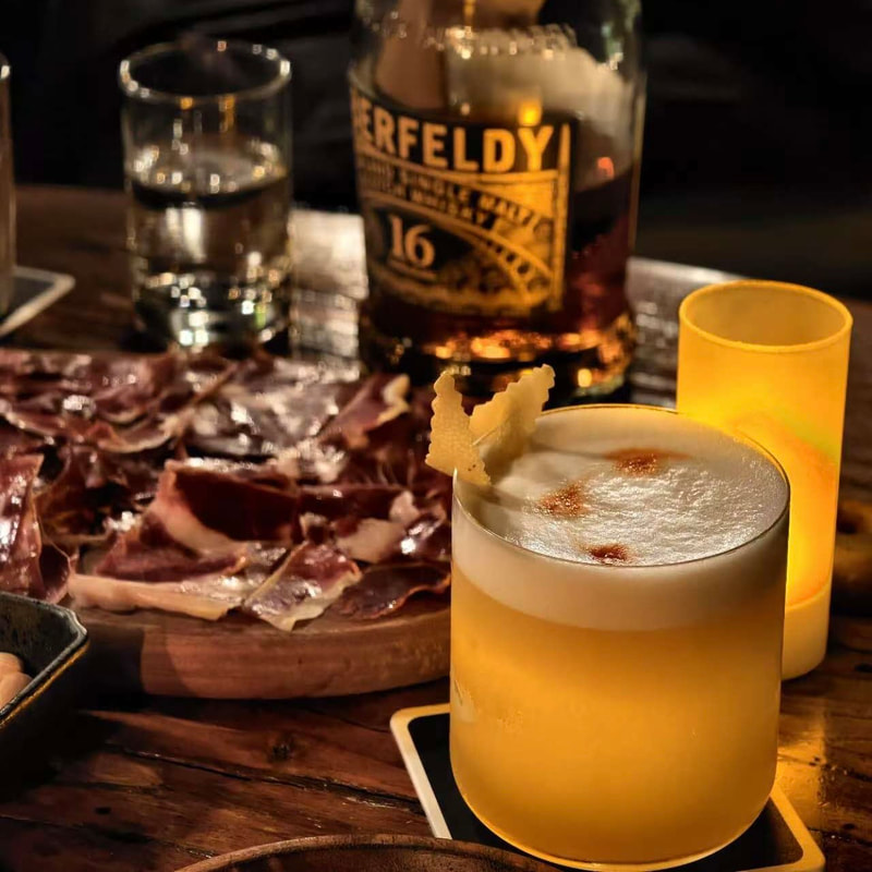Premium whiskey and crafted cocktails with charcuterie